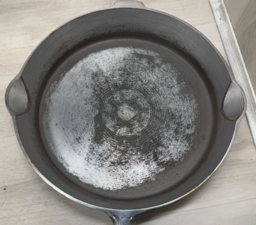 Griswold plated cast iron number 13 skillet with large block logo EPU, heat ring, pattern number 720. Sold for $2,100